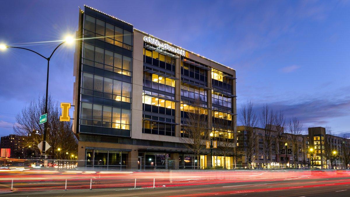 The Urban Design Center building at dusk with the University of Idaho logo on the side.