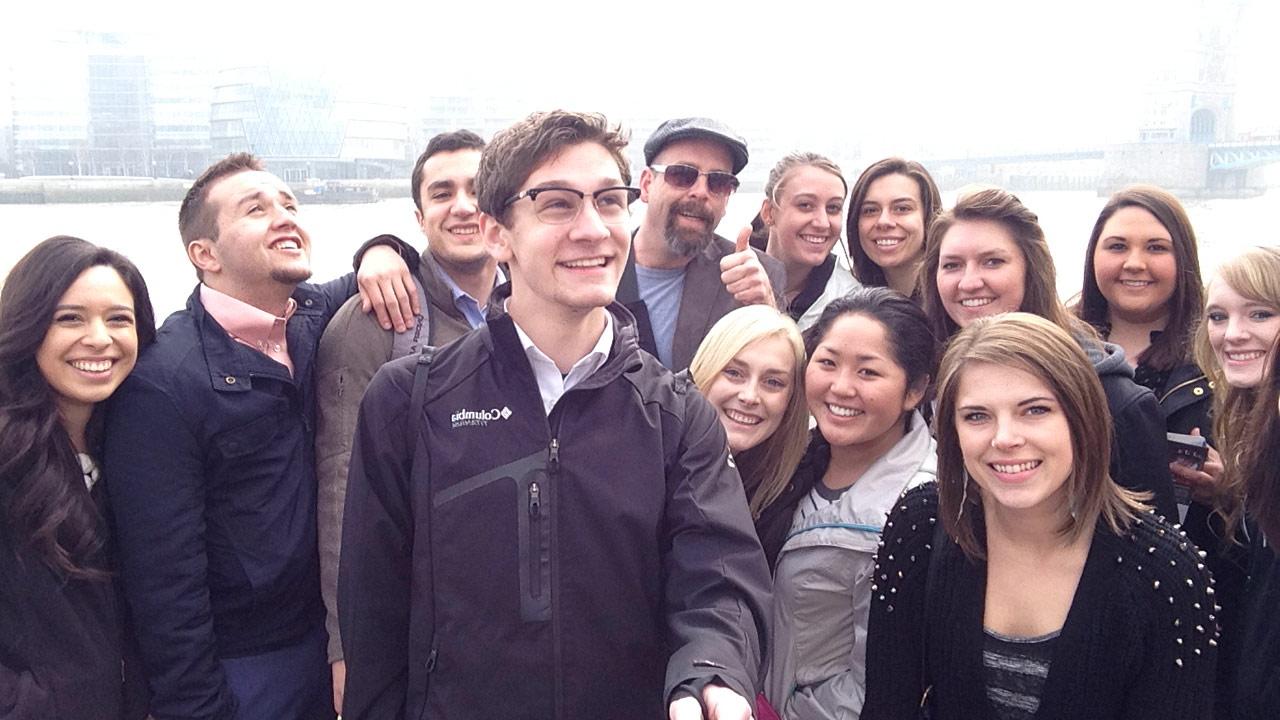 Brian Wolf and a group of students posing near the Thames.